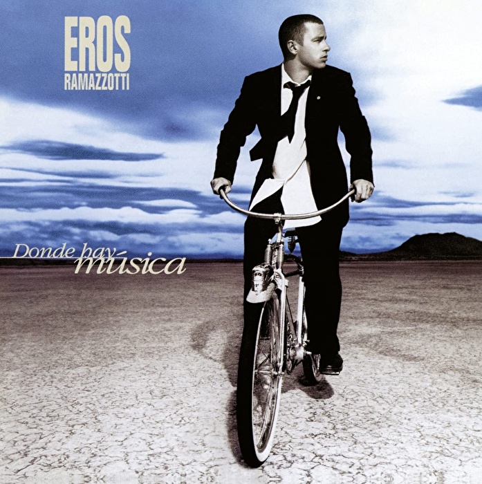 Eros Ramazzotti – Donde Hay Música (2021 Reissue, Remastered, Transparent Blue, 25th Anniversary Edition)